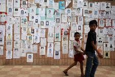 Dhaka, Bangladesh - The True Cost: "It was these two boys walking in front of this huge wall of missing person signs."